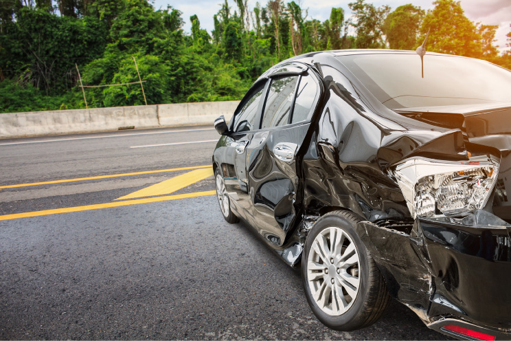 Photograph of rear-end damage on car in a car accident