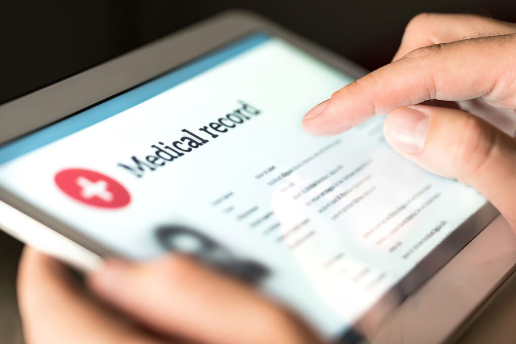 A person scrolling through a Medical Record on their Tablet.